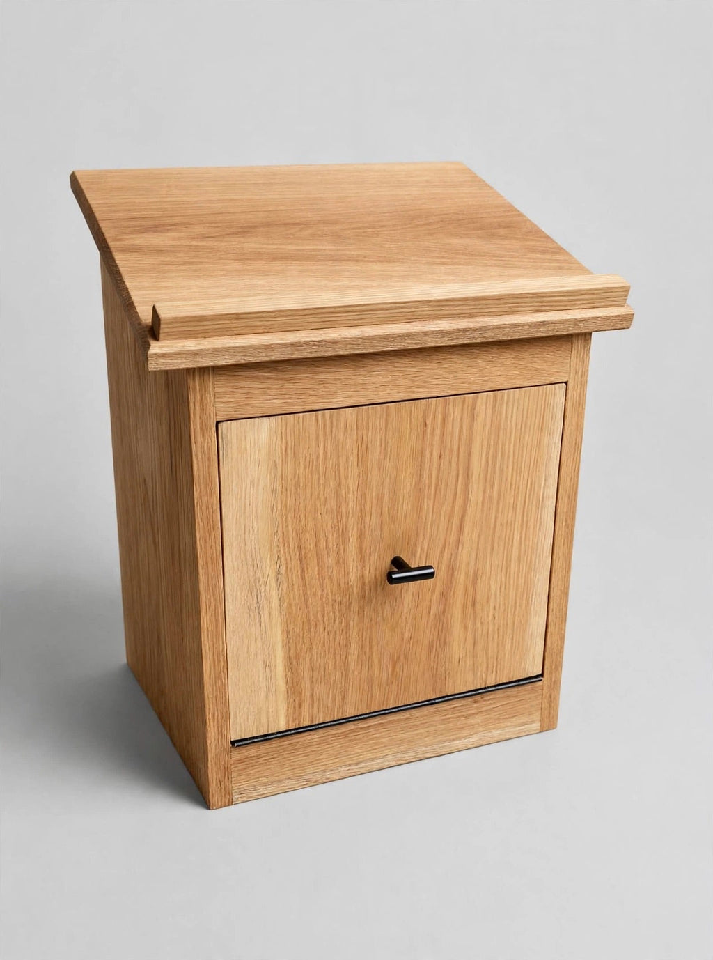 Handcrafted white oak tabletop shtender featuring a custom Hebrew name engraving and a front storage compartment. Perfect personalized Judaica gift.